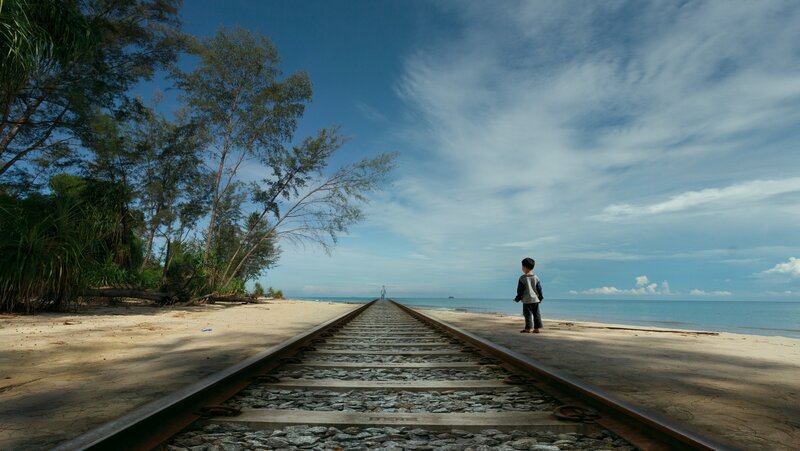 Child on Beach Train Tracks — Blue