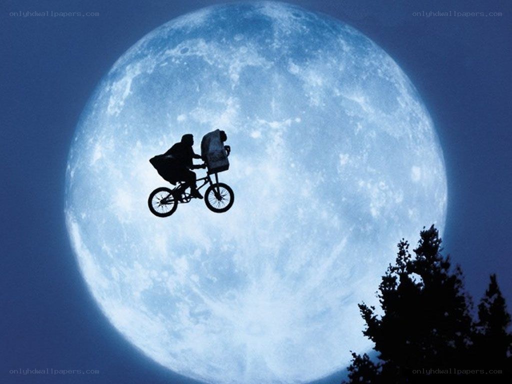 Child on bike with alien
