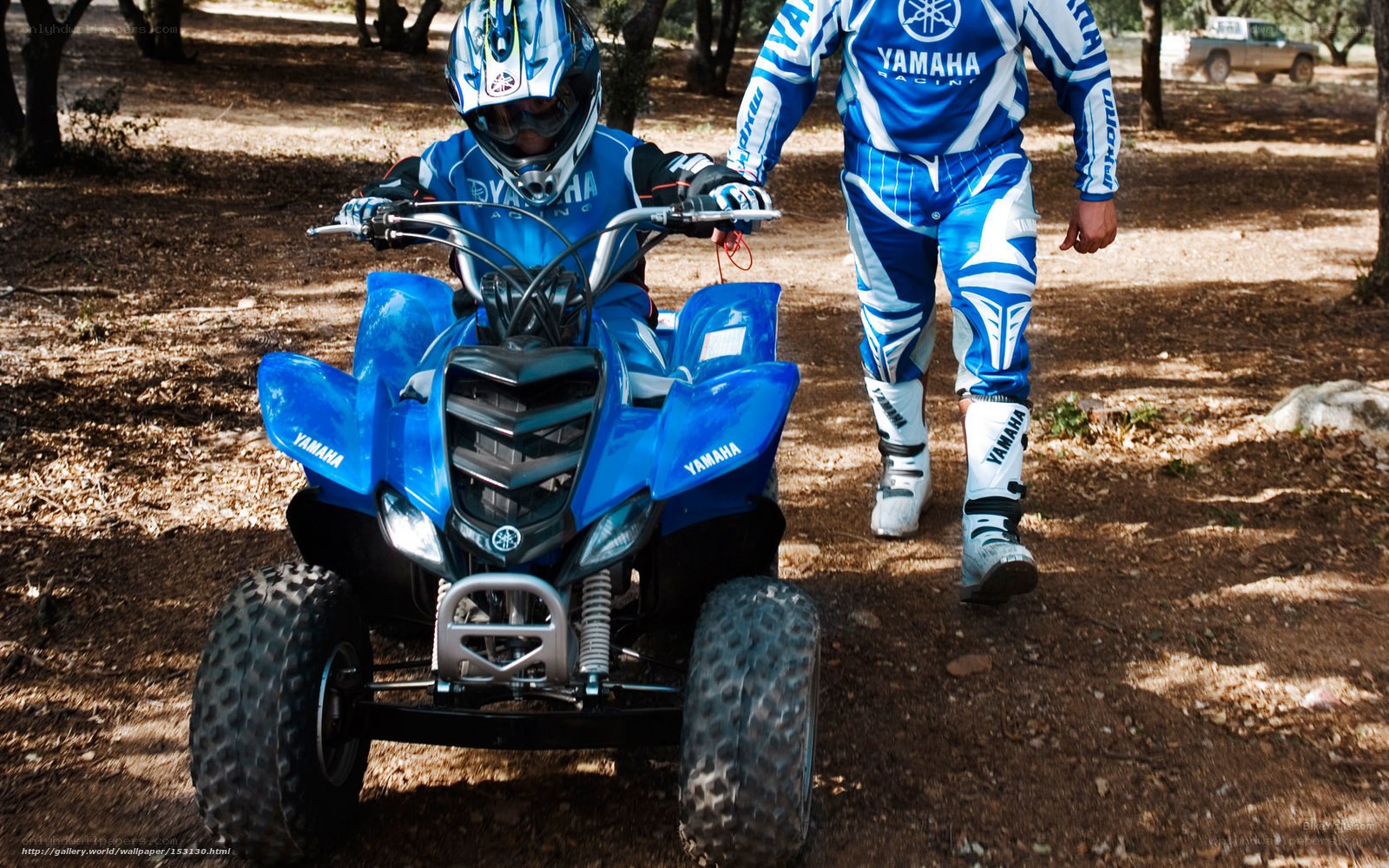 Child on blue Yamaha ATV