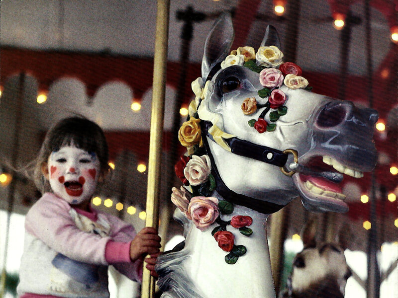 Child on Carousel Horse — White