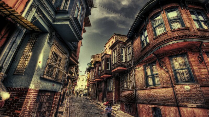 Child on Cobblestone Street — Red