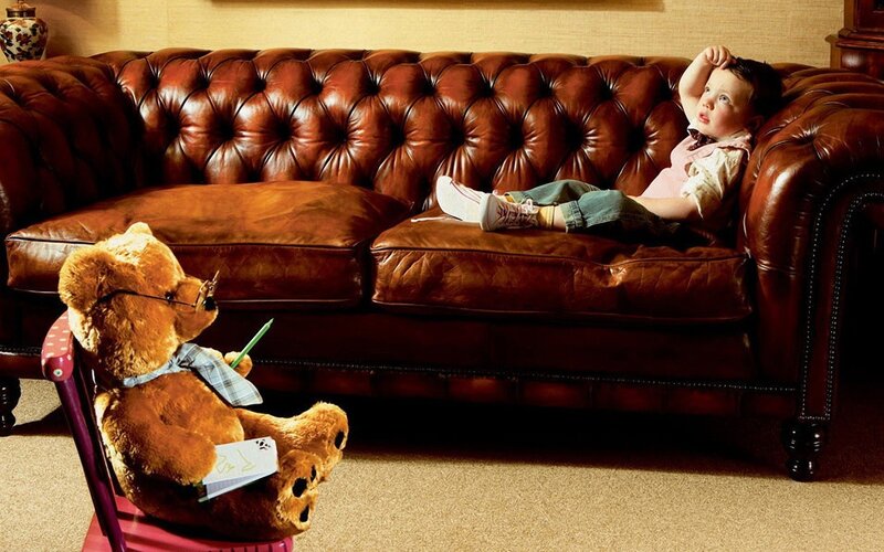 Child on Leather Couch