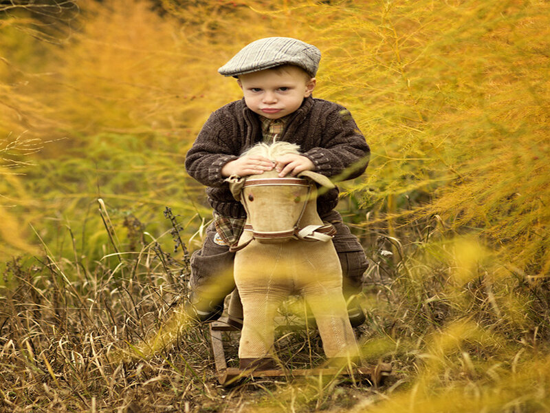 Child on Rocking Horse — Yellow