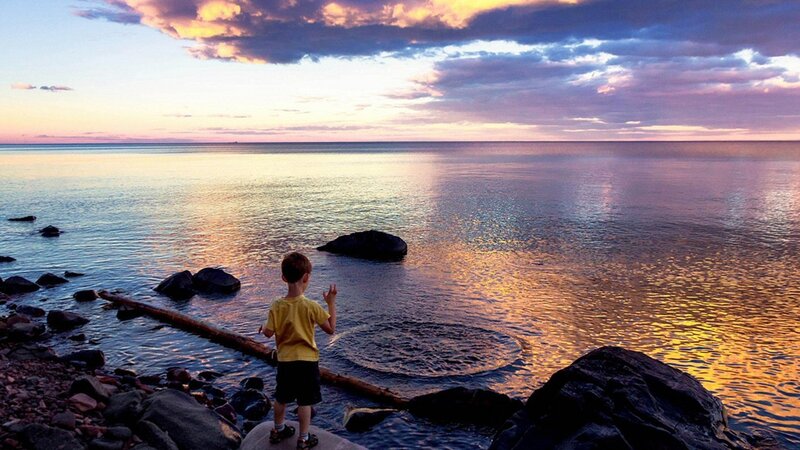 Child on Rocky Shore — Blue