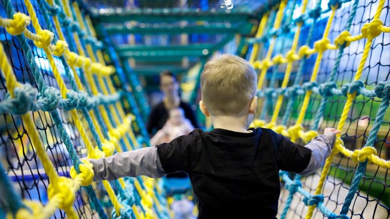 child on rope bridge