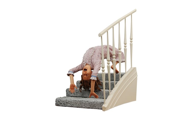 child on stairs sculpture