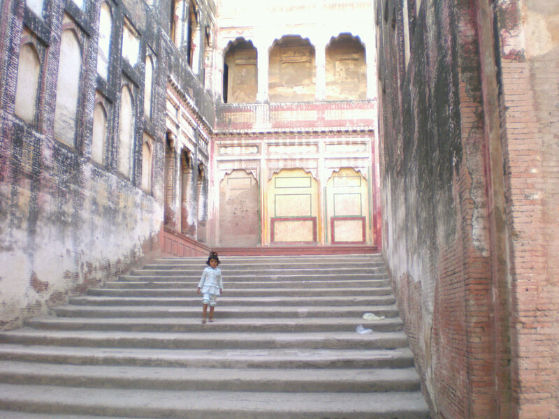 child on stone stairs