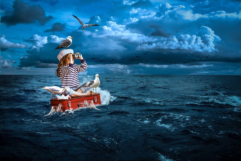 Child on Suitcase Boat