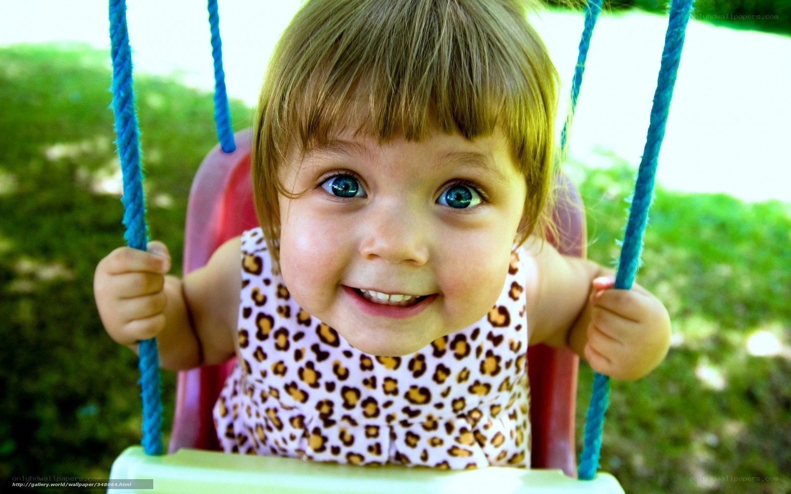 child on swing smiling