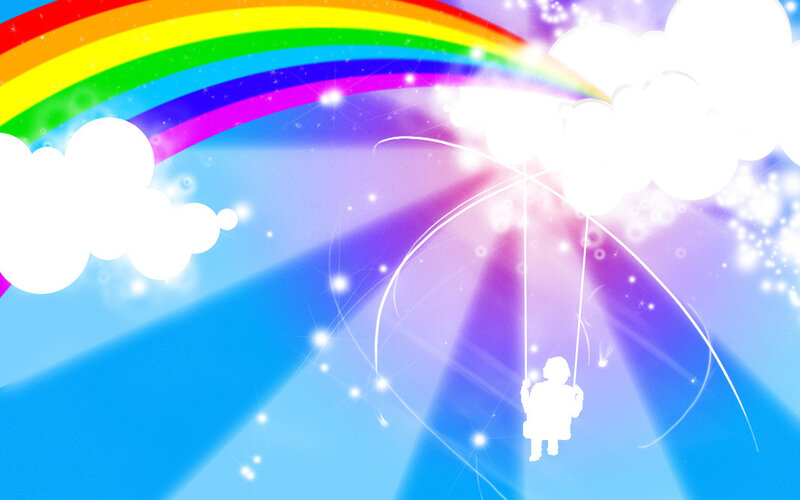 child on swing under rainbow