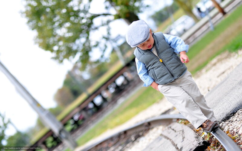 child on train tracks