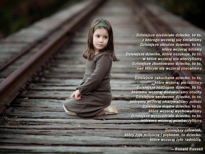 child on train tracks with poem