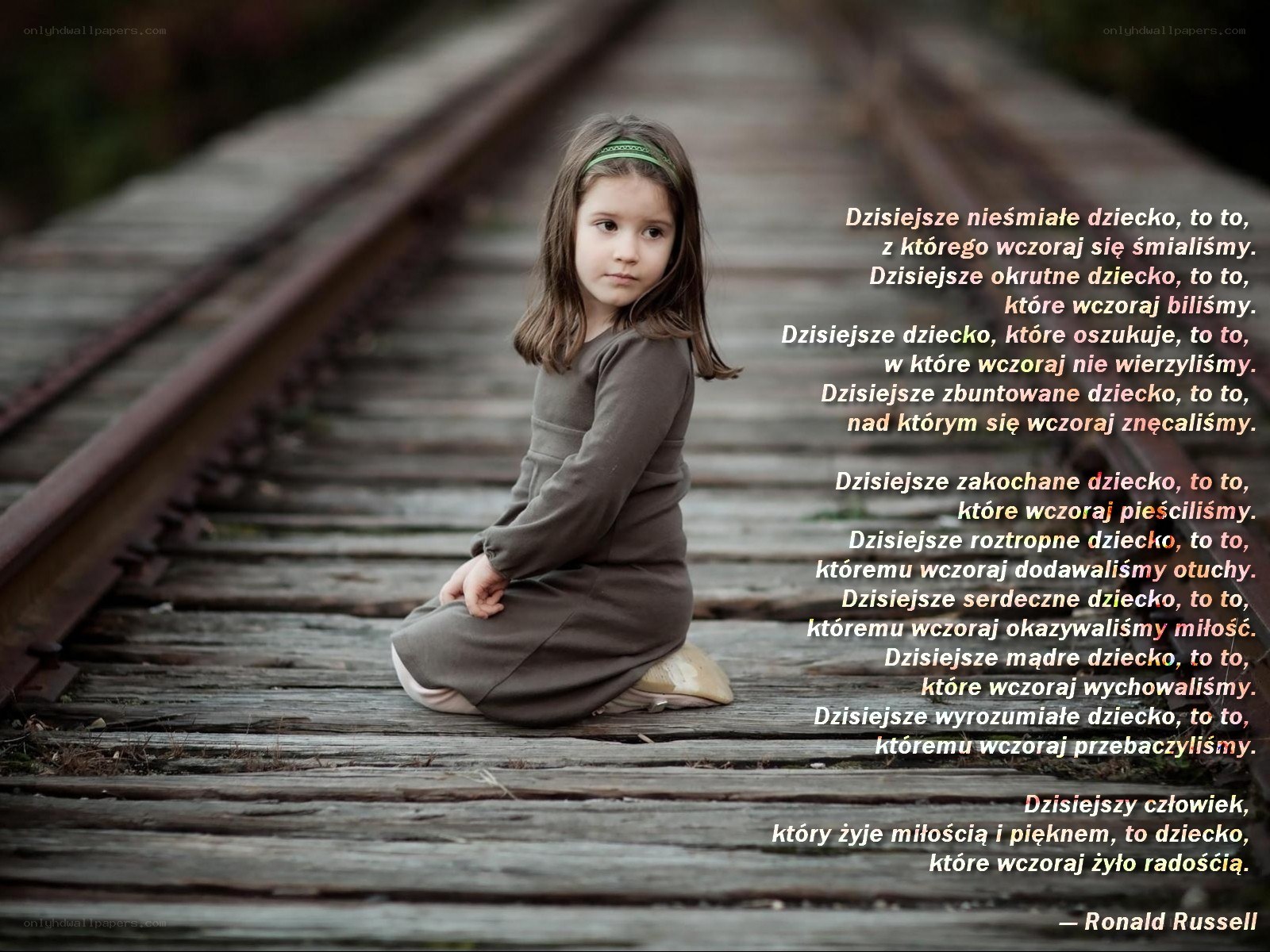 child on train tracks with poem