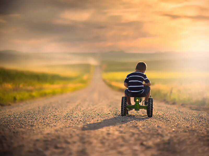 Child on Tricycle — Brown, Serene