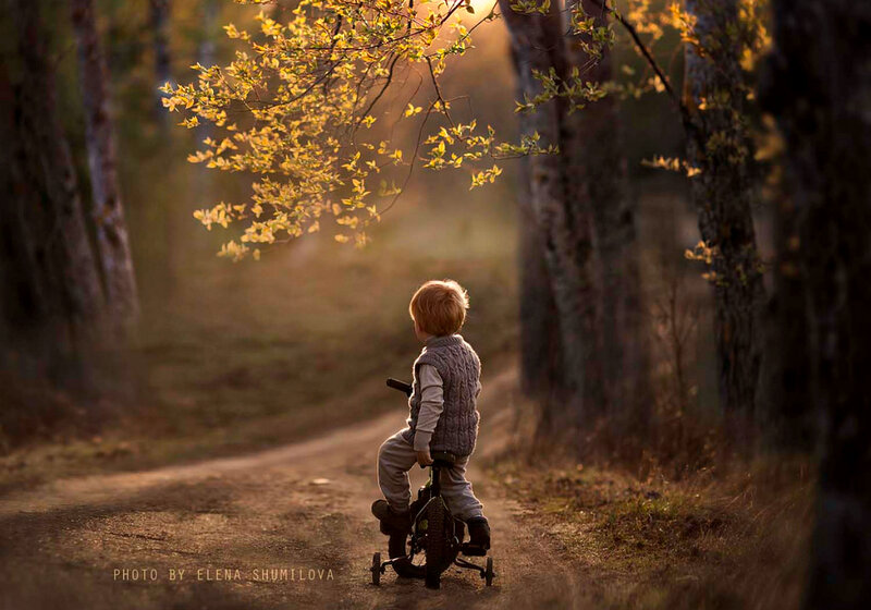Child on Tricycle — Brown