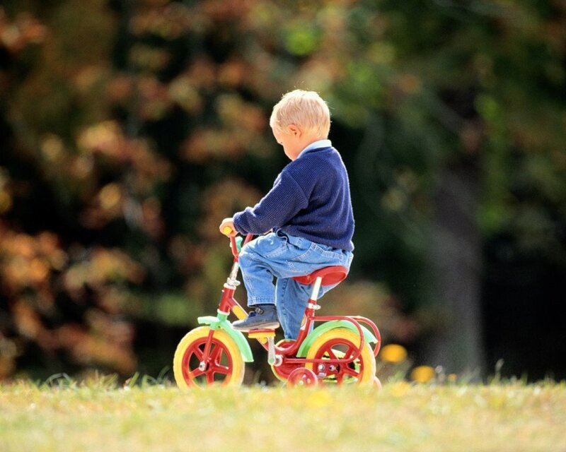 Child on Tricycle — Green
