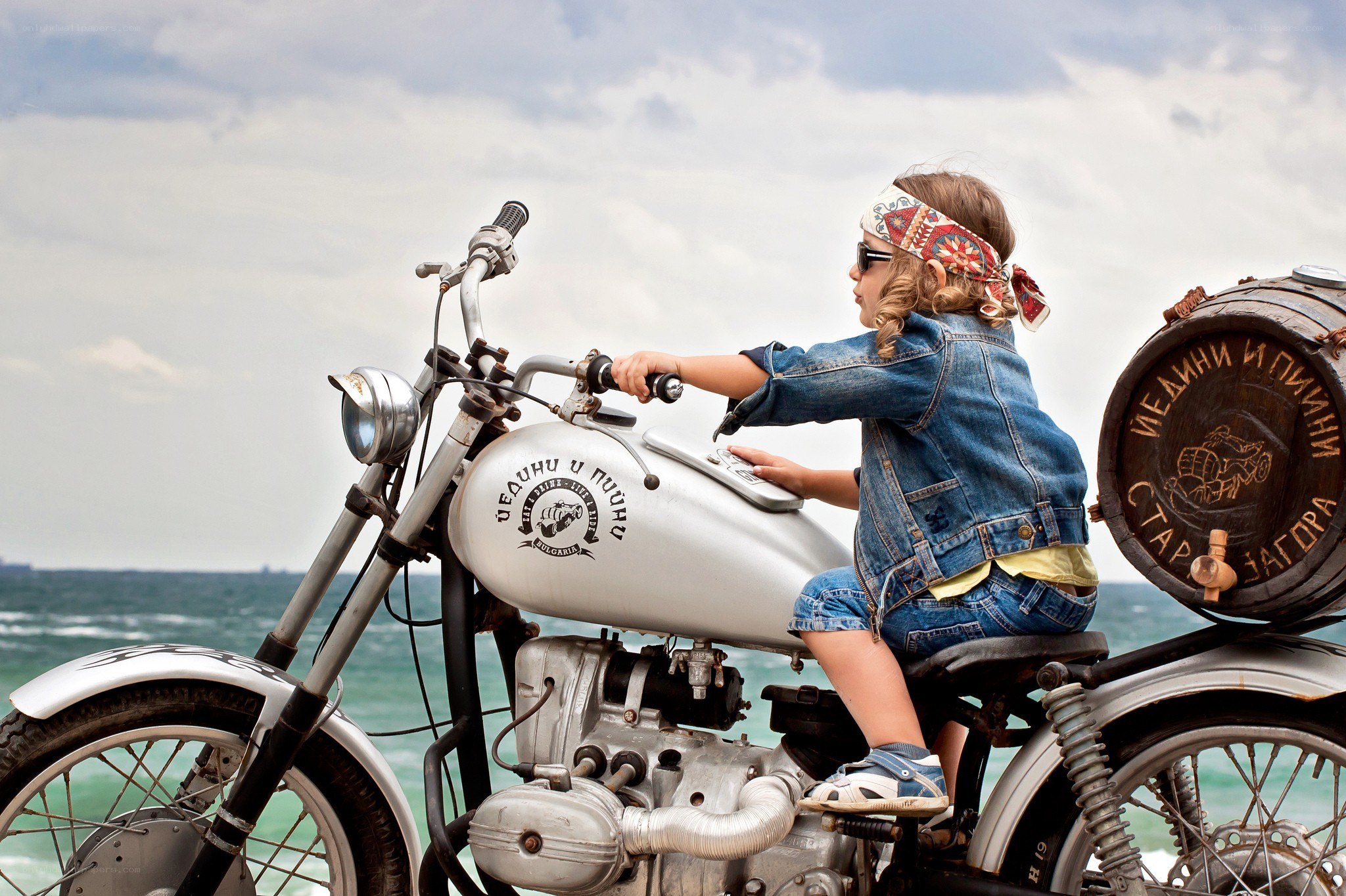 child on vintage motorcycle