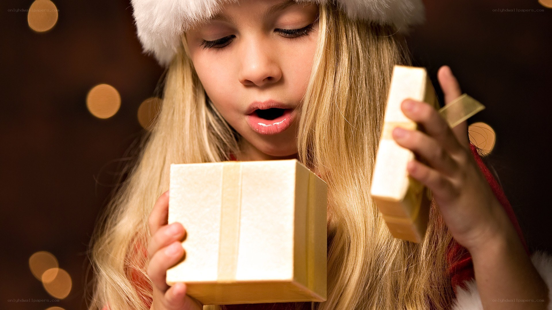 child opening christmas gift
