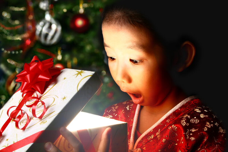 Child Opening Gift — Red, Dramatic