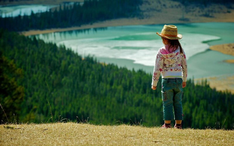 Child overlooking a lake