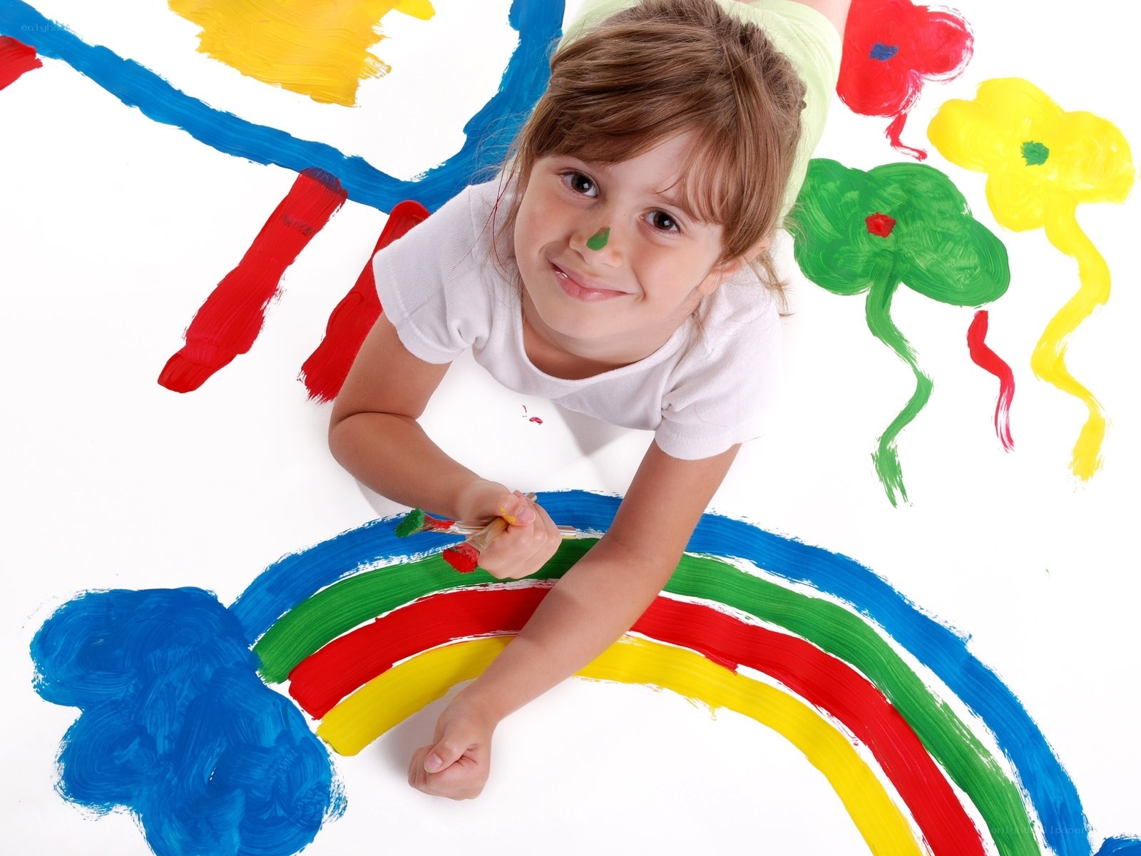child painting a rainbow