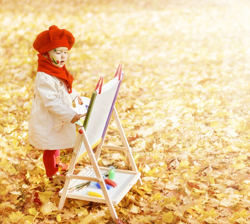 Child Painting Outdoors
