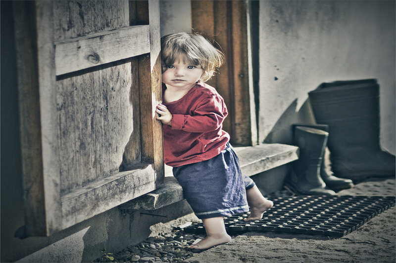 Child Peeking from Door