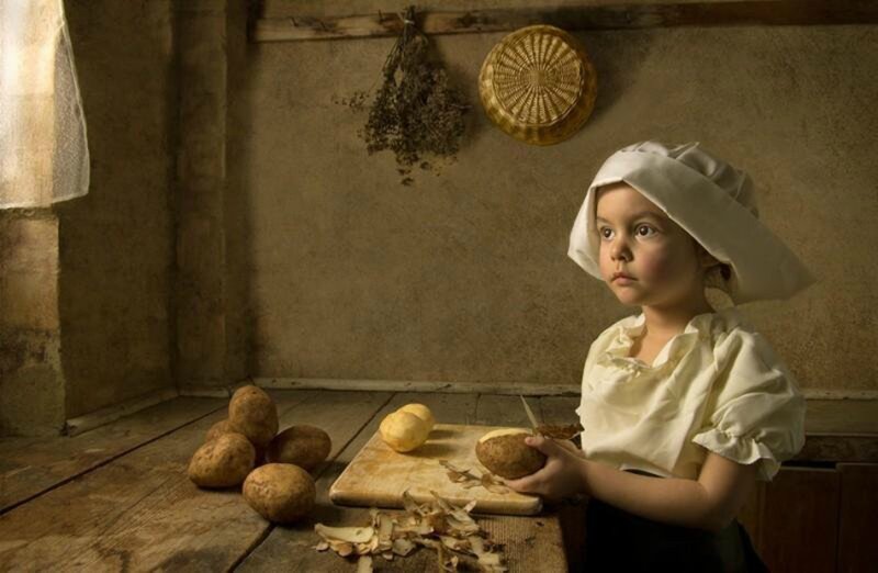 Child Peeling Potatoes