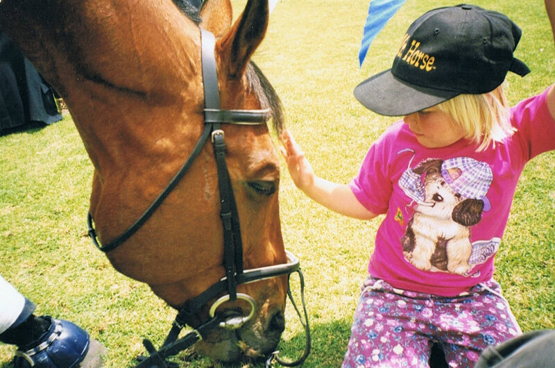 Child Petting Horse