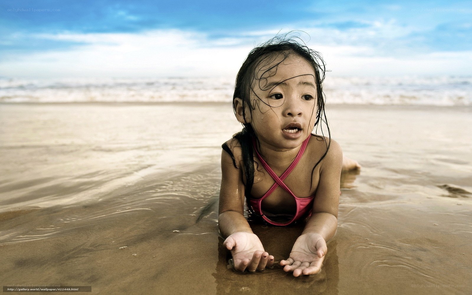 child playing at the beach