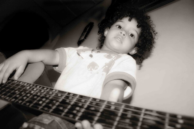 child playing bass guitar