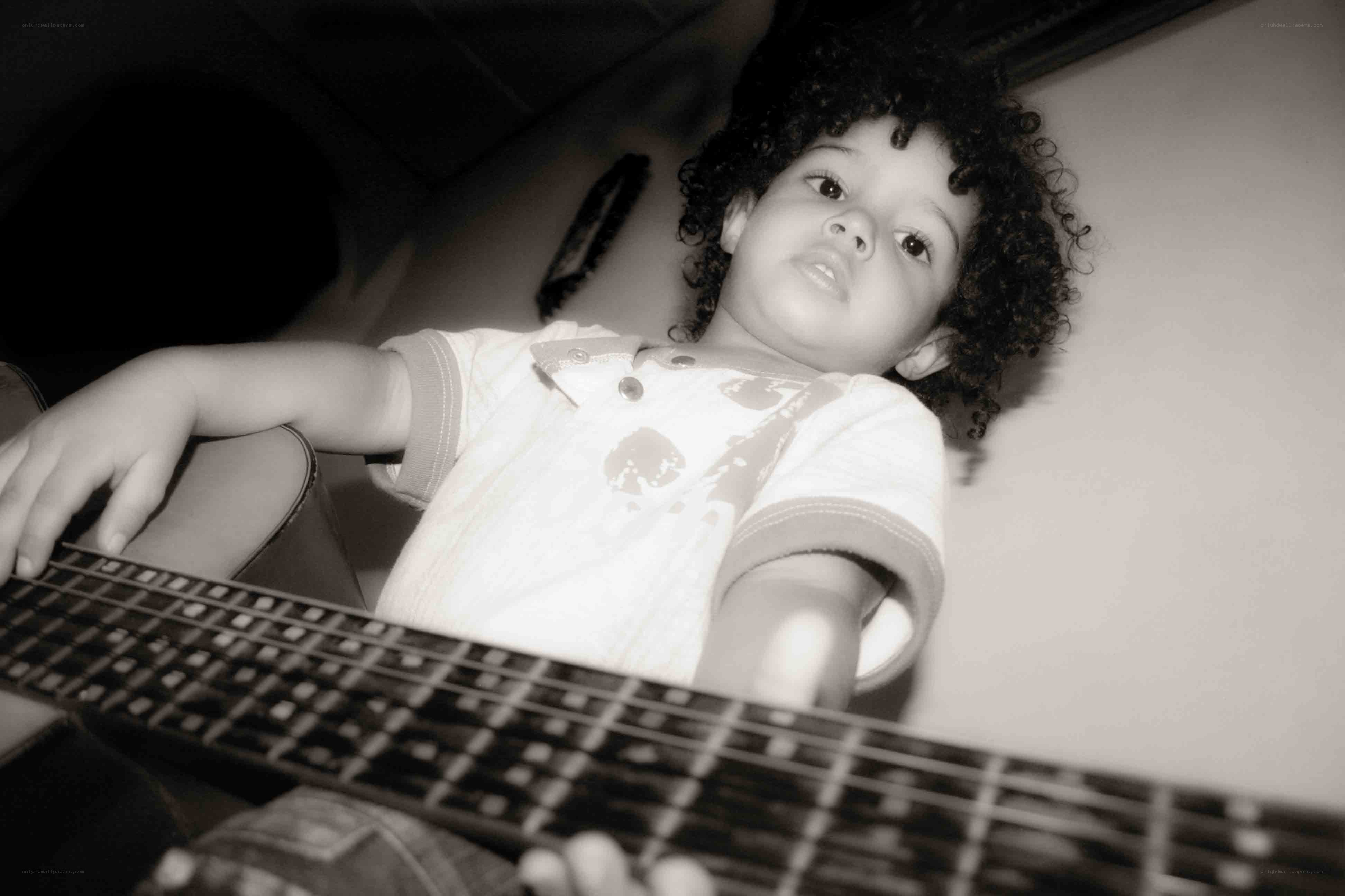 child playing bass guitar