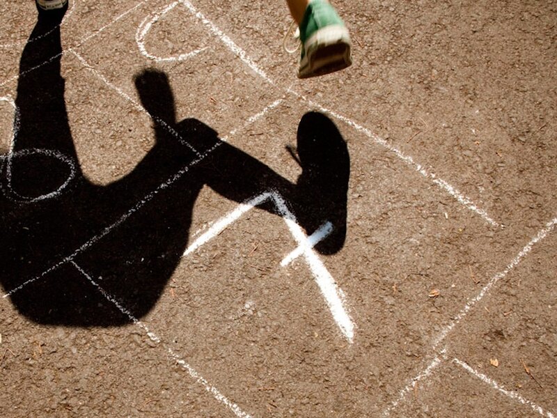 Child playing hopscotch