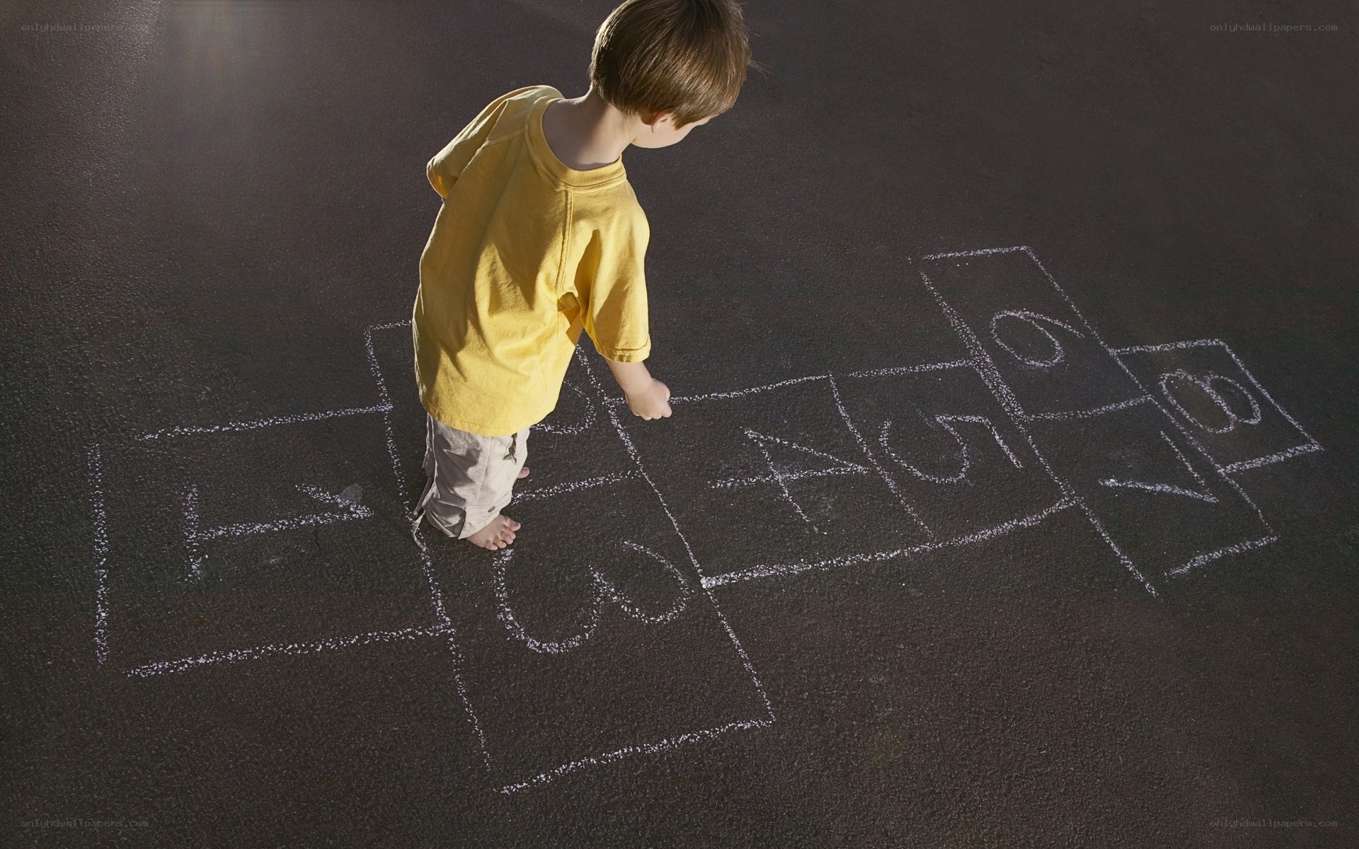 Child playing hopscotch