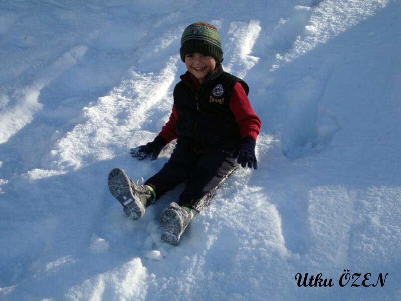 child playing in snow