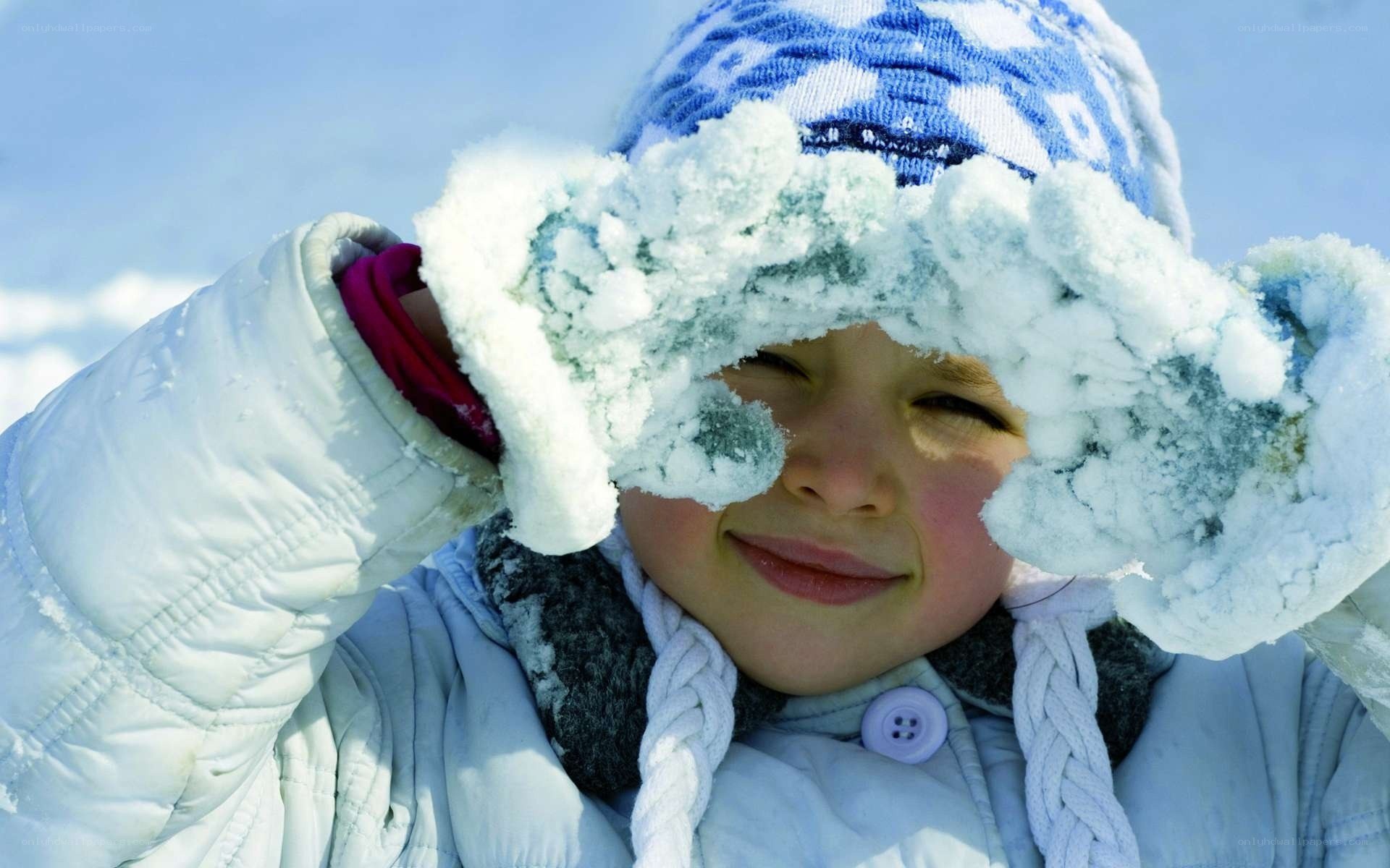 child playing in snow