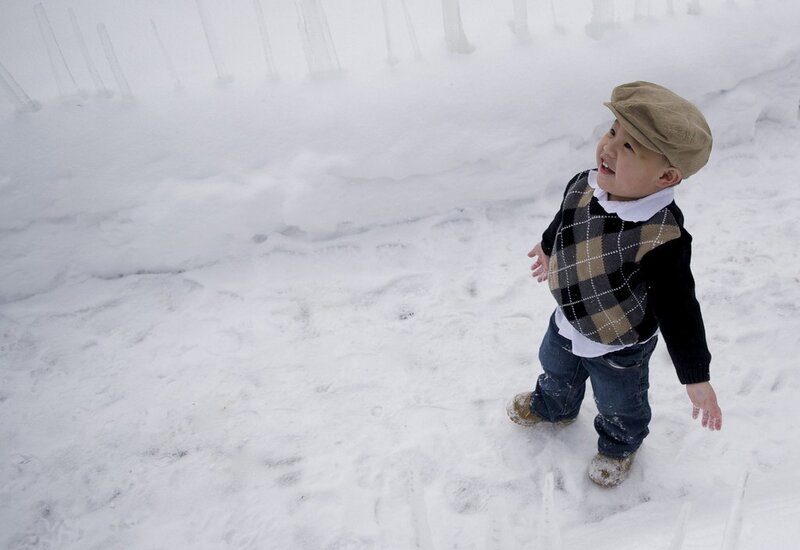 child playing in snow