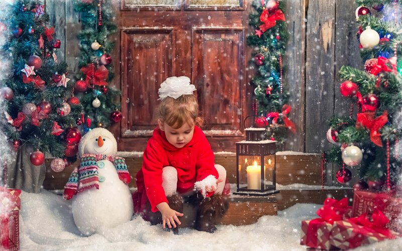 Child Playing in Snow — Red