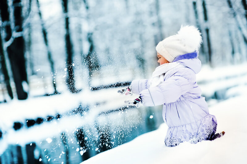 Child Playing in Snow — White