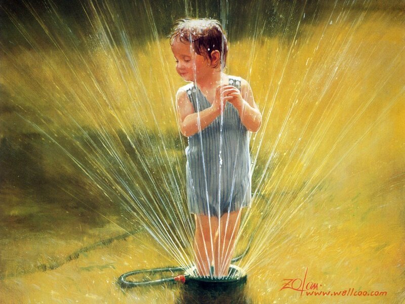 child playing in sprinkler