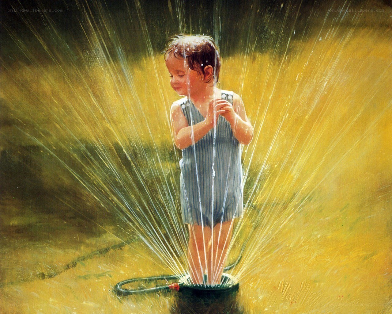 child playing in sprinkler