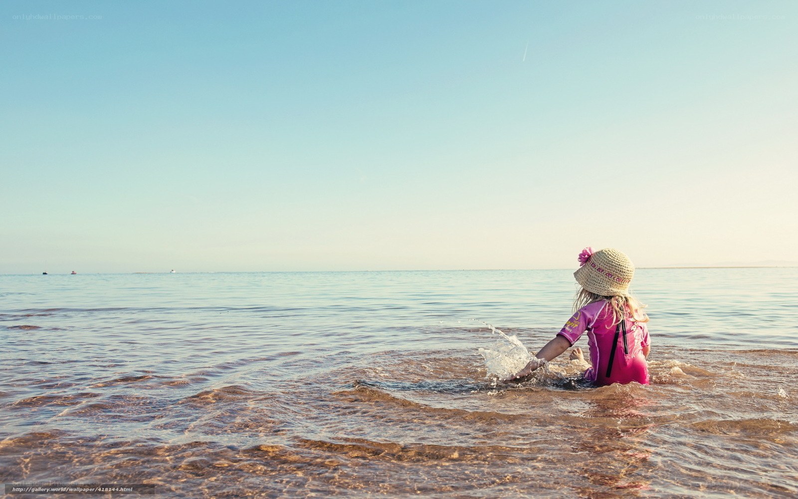 child playing in the sea