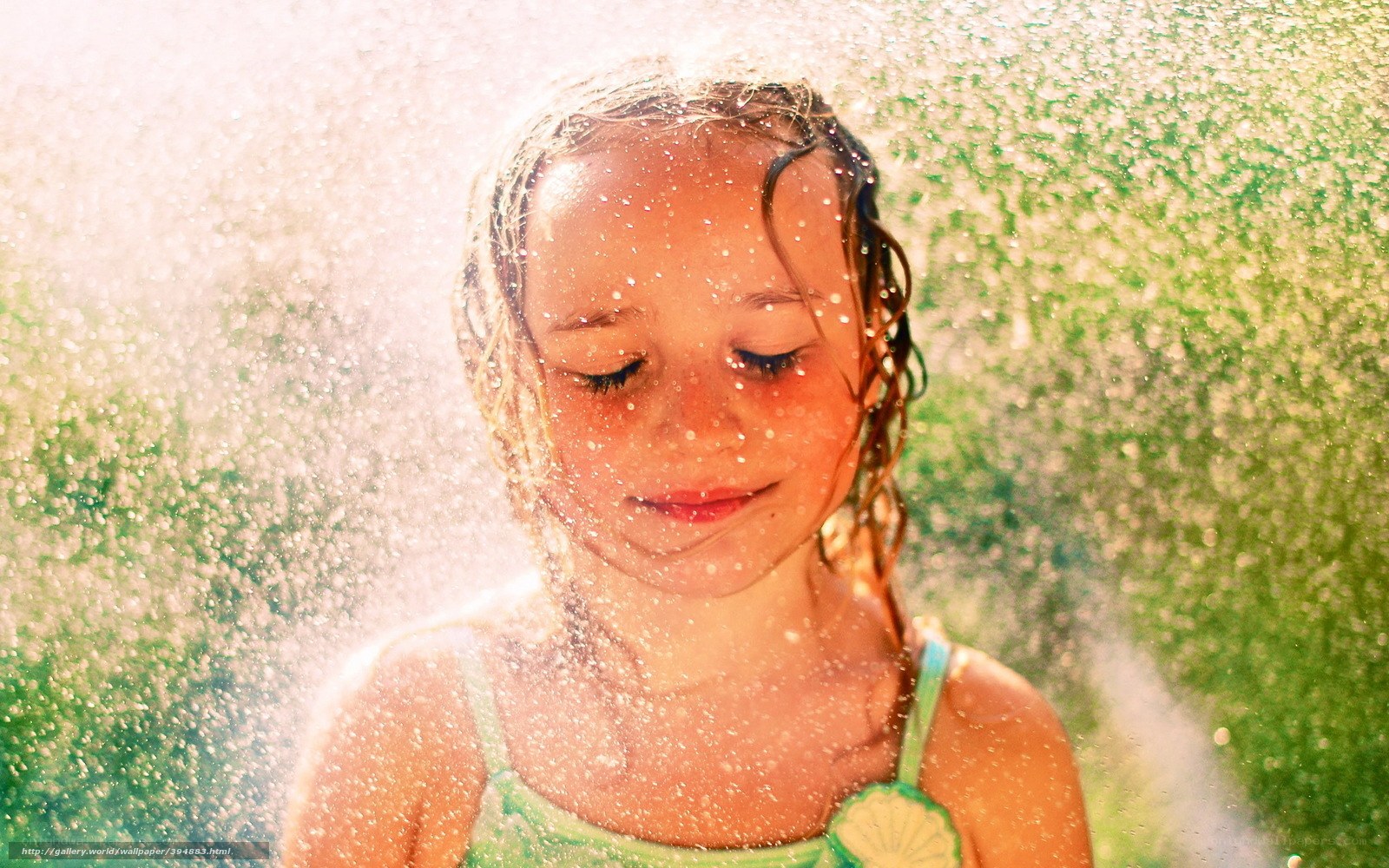 child playing in water spray