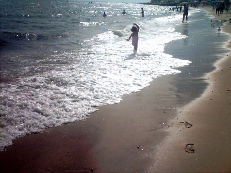 Child Playing in Waves