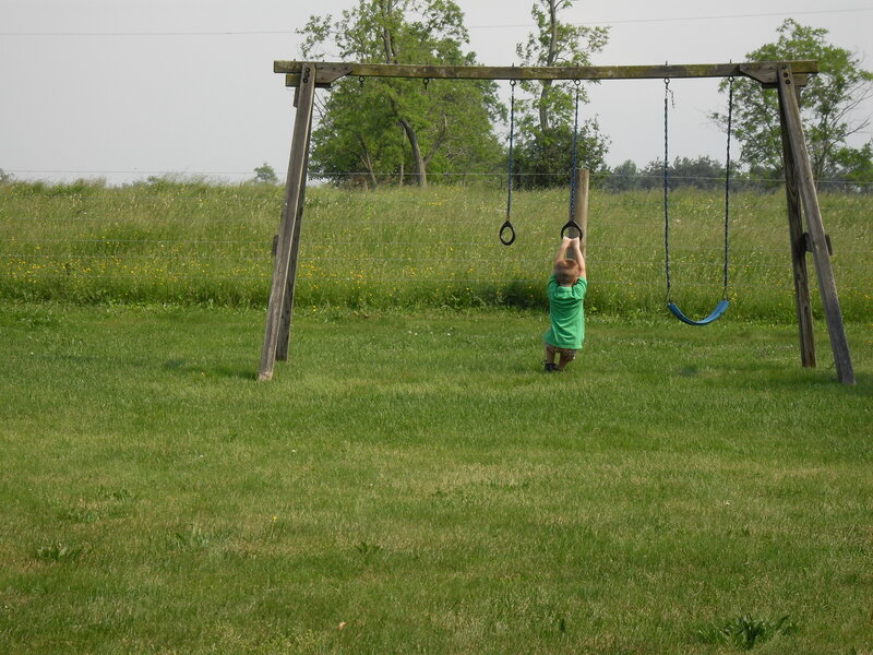 Child playing on swing set