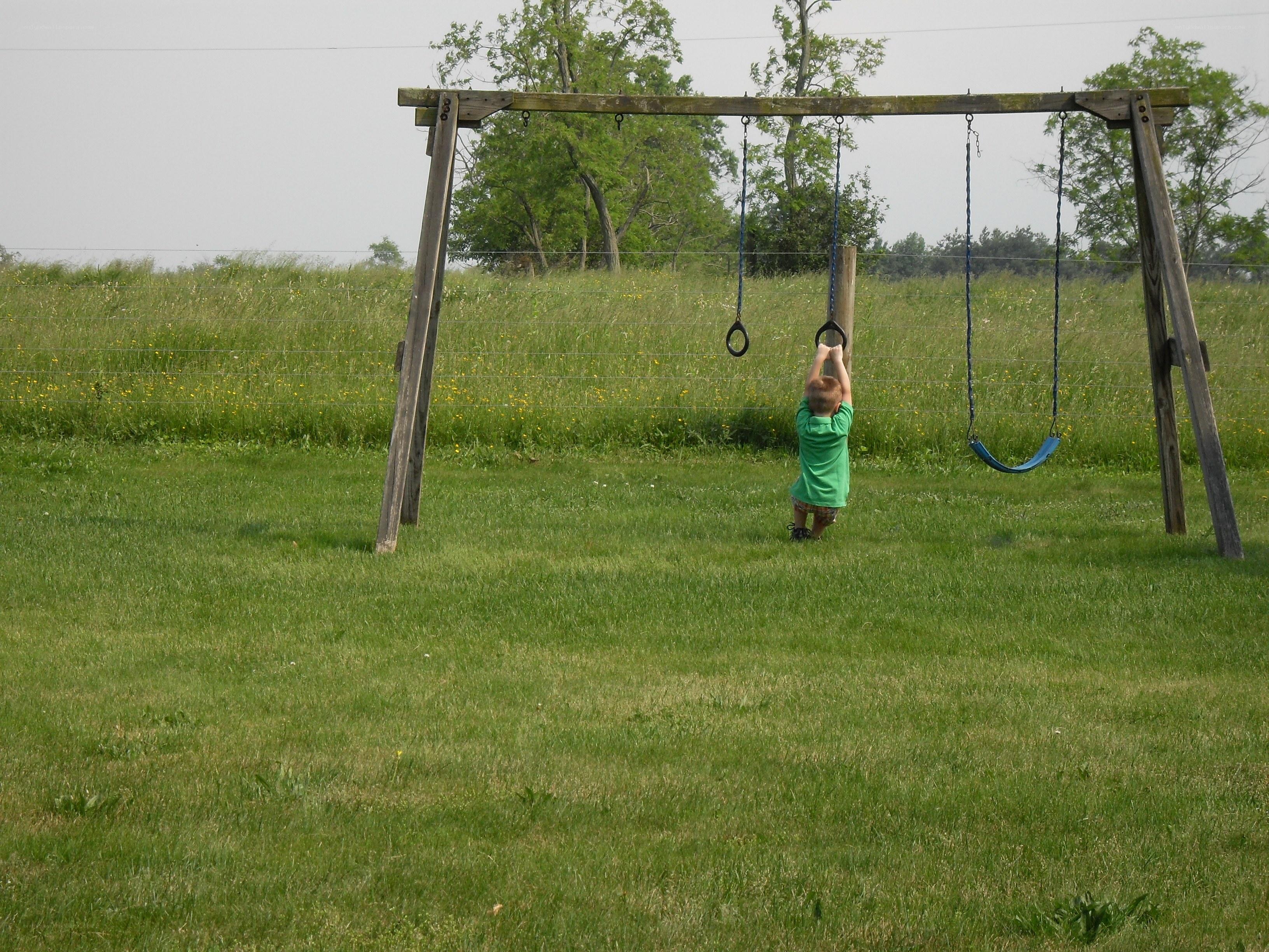 Child playing on swing set