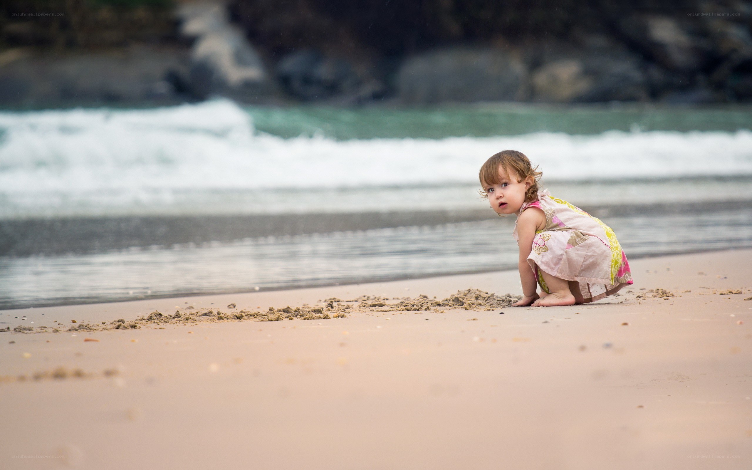 child playing on the beach