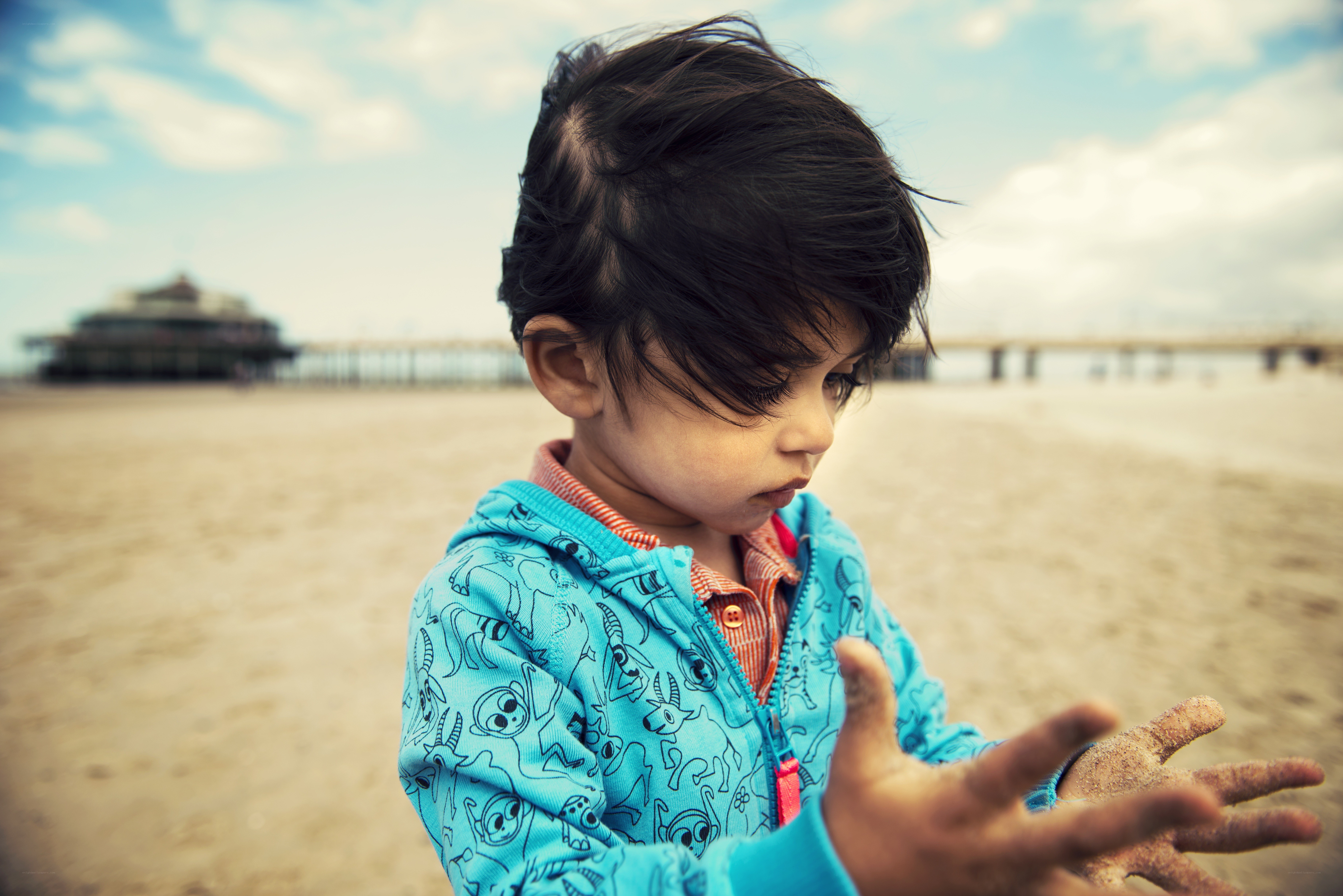 child playing on the beach