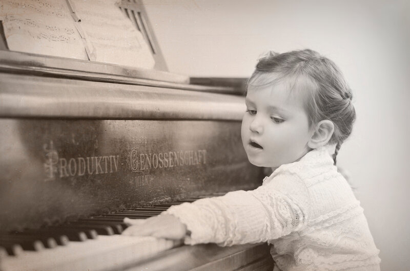 Child Playing Piano — Sepia