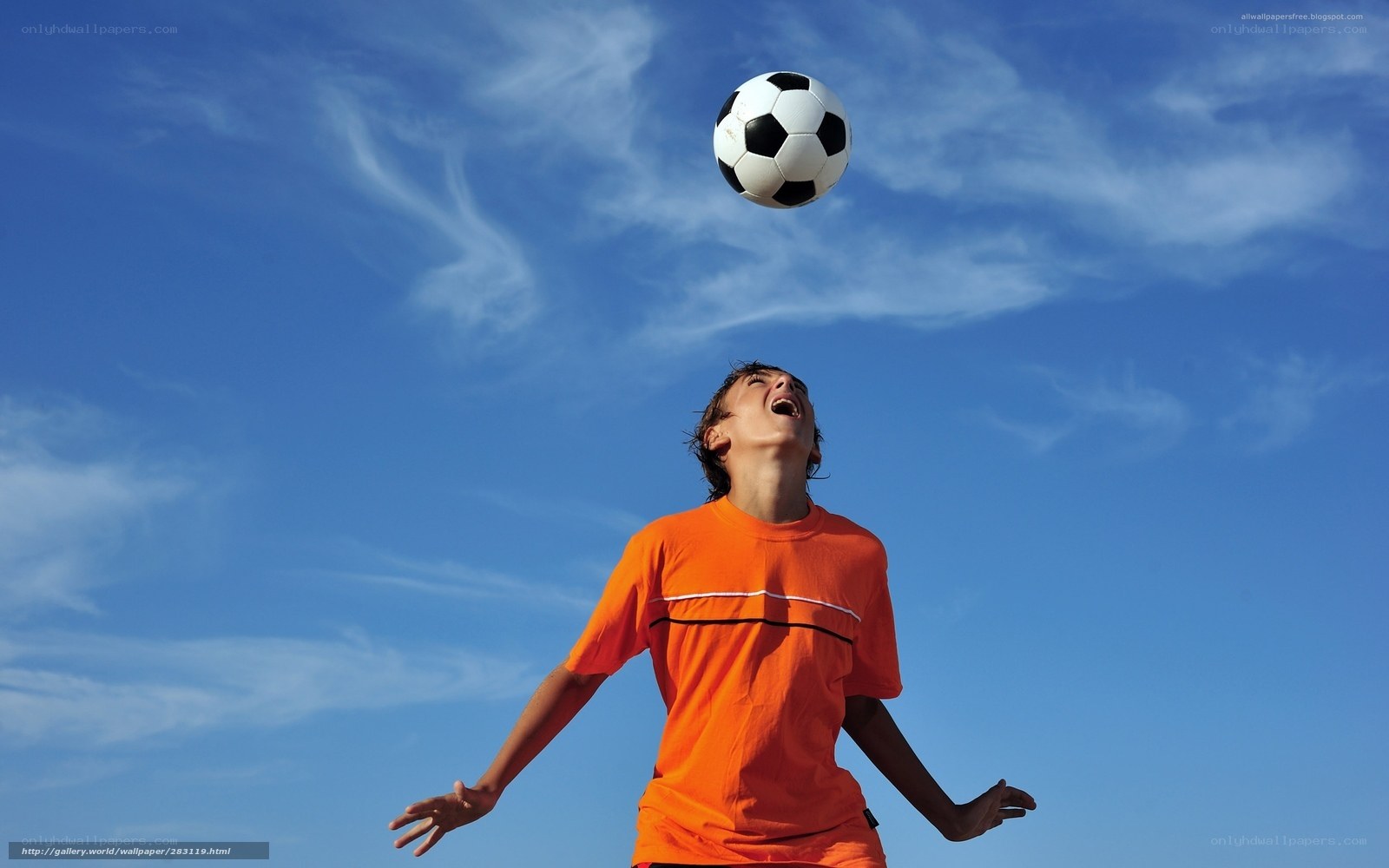 child playing soccer outdoors